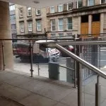 Exterior stainless steel banister with glass balustrade