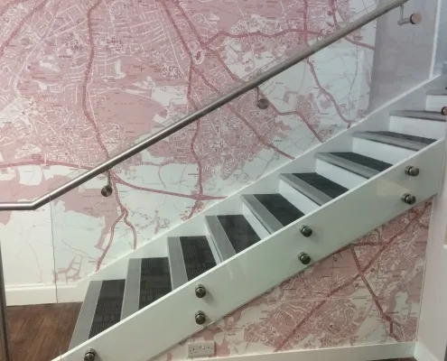Interior stainless steel banister with glass balustrade